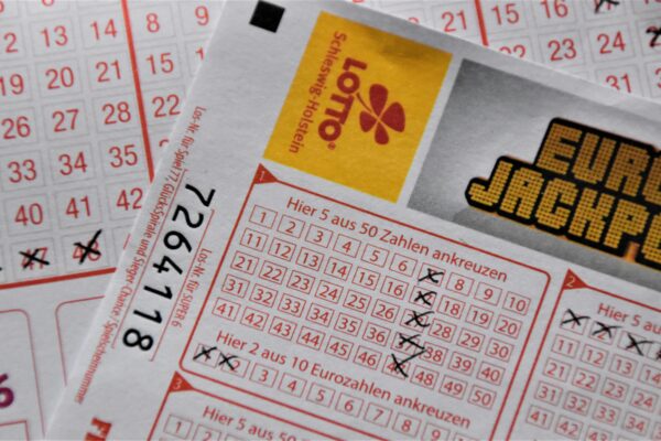 Detailed close-up of a EuroJackpot lottery ticket with selected numbers in focus.